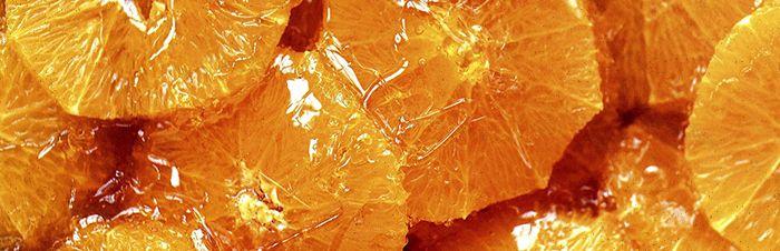 Orange slices dipped in honey and cinnamondessert recipe image